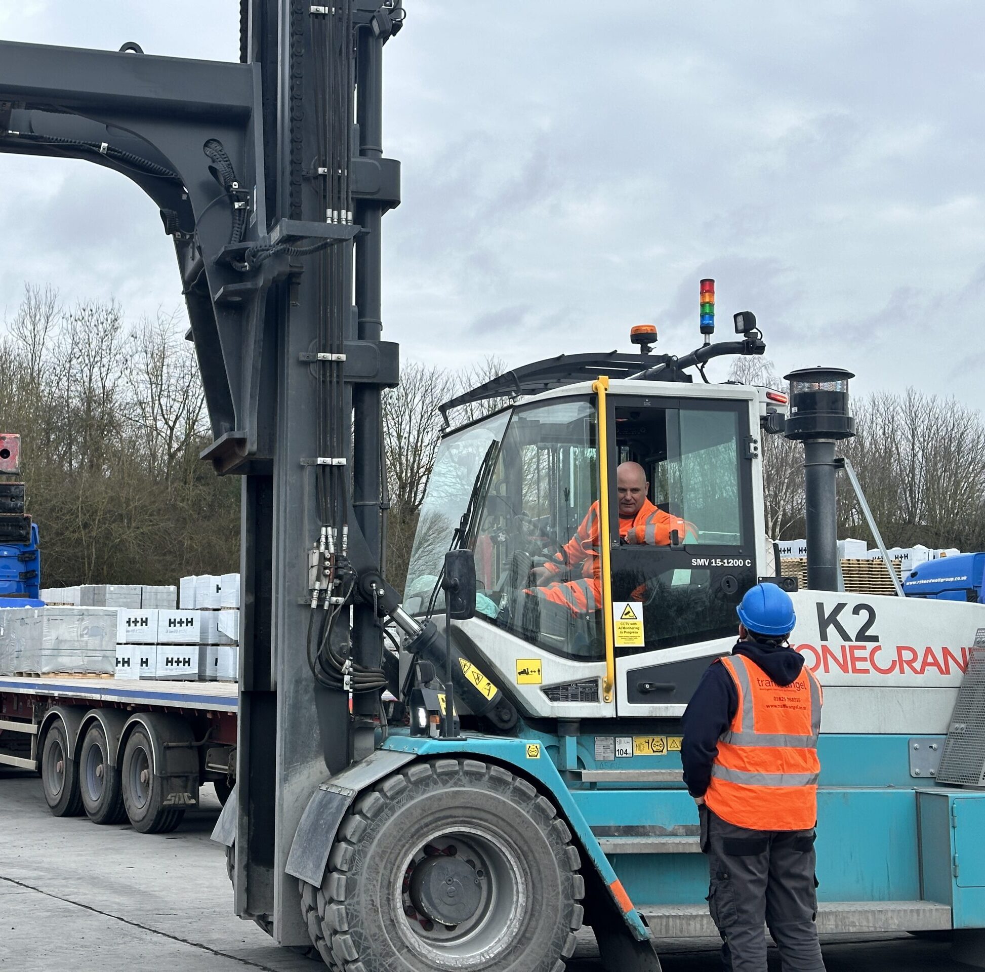 Forklift fitted with Digital Thumbs Up safety display for site pedestrians